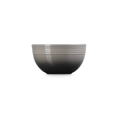 Gray bowl with a ribbed texture on a white background