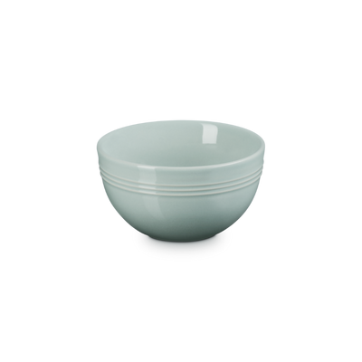Light green ceramic bowl on a white background