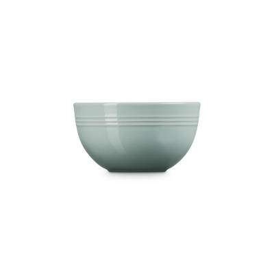 Green ceramic bowl on a white background