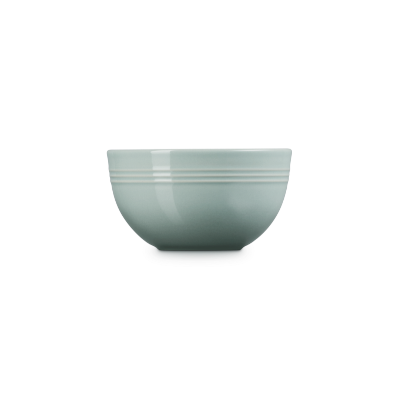 Green ceramic bowl on a white background
