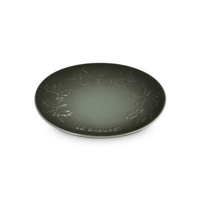 Black decorative plate with floral patterns on a white background