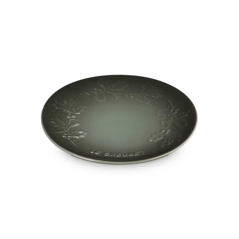 Black decorative plate with floral patterns on a white background