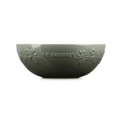 Green ceramic bowl with 'Le Creuset' branding on a white background