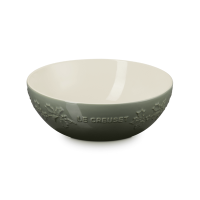 Green ceramic bowl with 'Le Creuset' branding on a white background