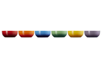 Set of six colorful bowls arranged in a row on a white background