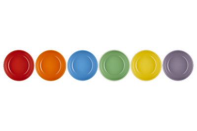 Set of six colorful plates in red, orange, blue, green, yellow, and purple on a white background.