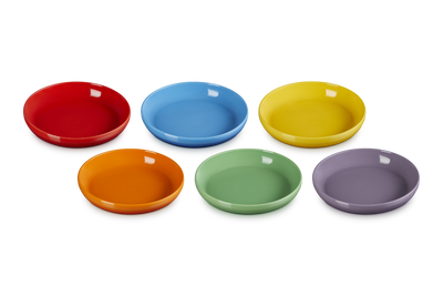 Set of six colorful ceramic bowls on a white background