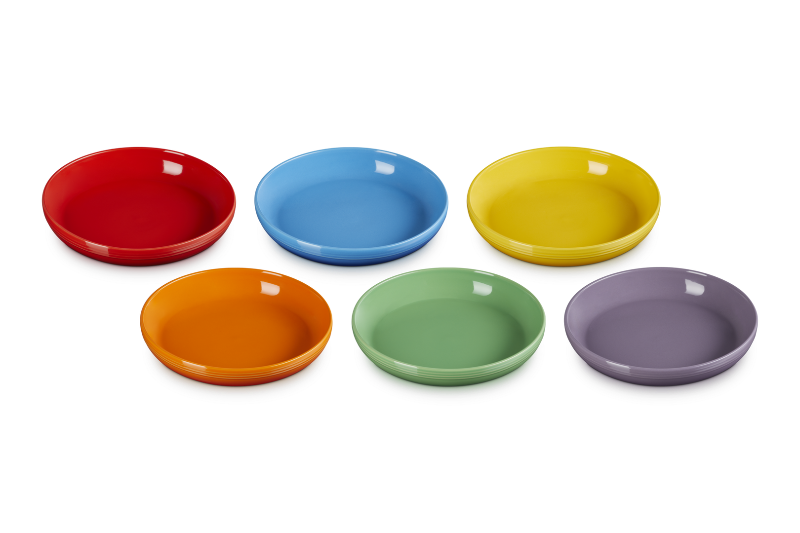 Set of six colorful ceramic bowls on a white background