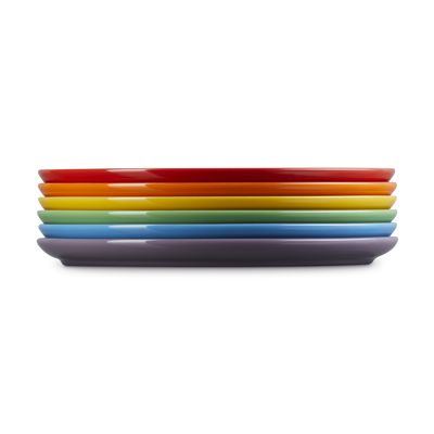 Stack of colorful plates on a white background