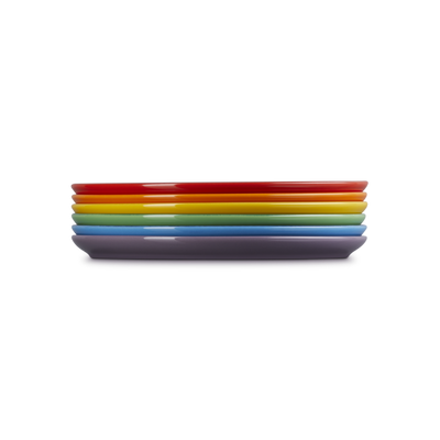 Set of colorful rectangular plates stacked on a white background