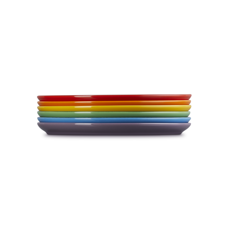 Set of colorful rectangular plates stacked on a white background