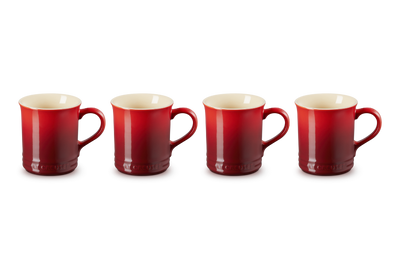 Four red mugs with beige interior on a white background