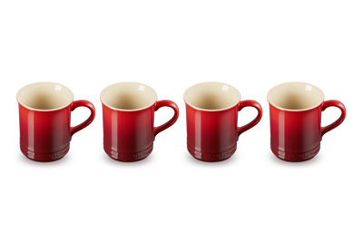 Four red mugs with beige interiors on a white background