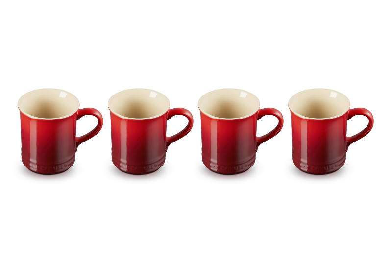 Four red mugs with beige interiors on a white background