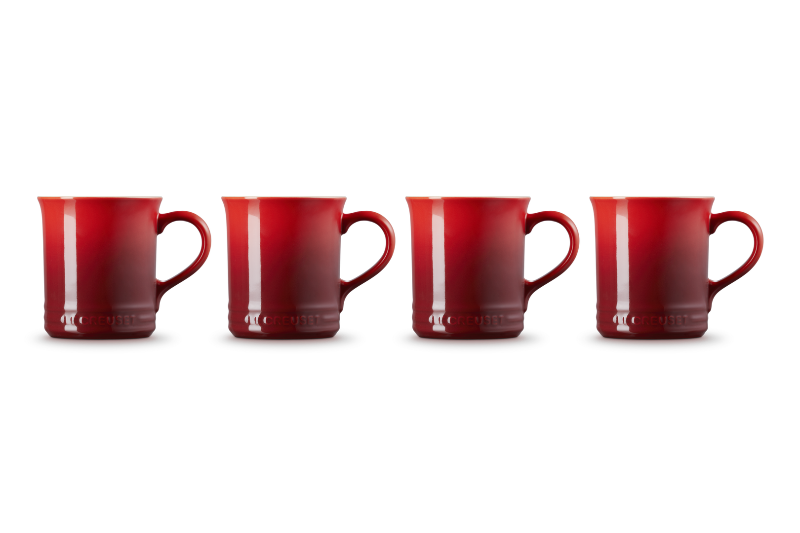 Four red mugs of varying sizes on a white background