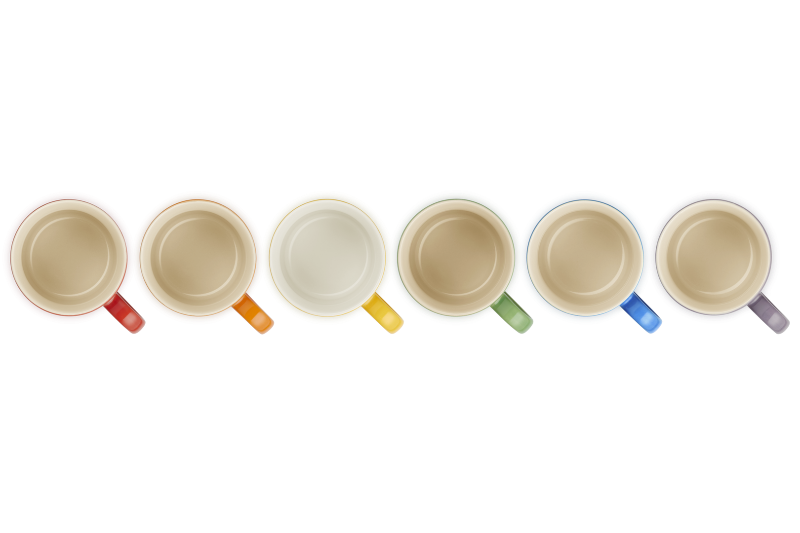 Set of seven mugs with colorful handles on a white background