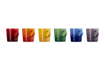 Set of colorful coffee cups arranged in a row on a white background