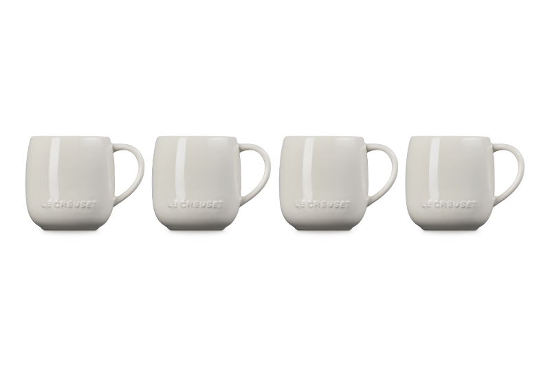 Four white mugs with &