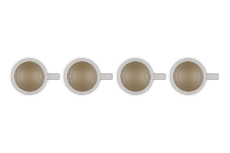 Four white mugs with brown interior on a white background