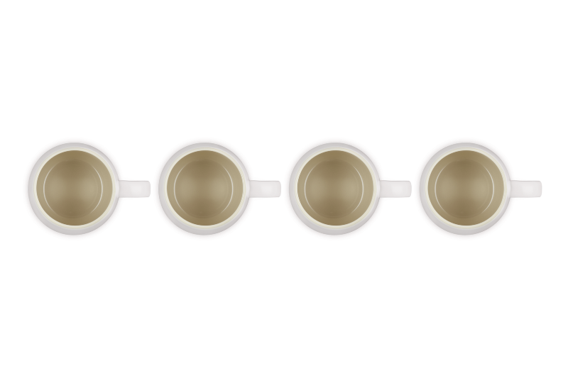 Four white coffee cups with gold interior on a white background