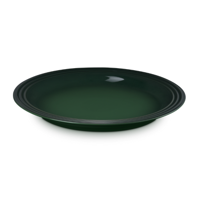 Green ceramic plate on a white background