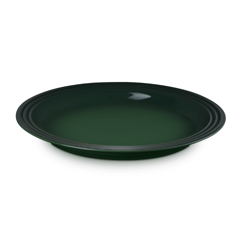 Green ceramic plate on a white background