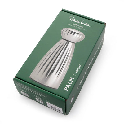 Green packaging box with a silver pepper mill design on a white background