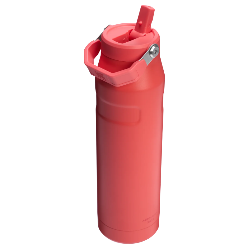 Red water bottle with a straw on a white background