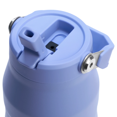 Close-up of a blue water bottle with a lid on a white background