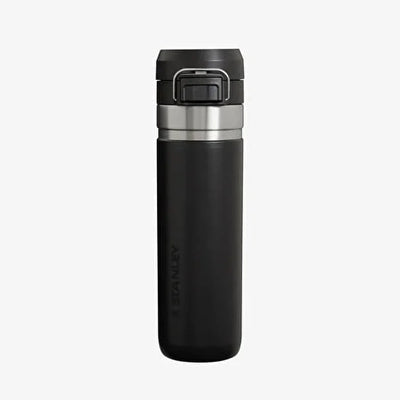 Black insulated drink bottle with silver lid on a light gray background