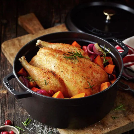 Chicken cooking in Staub enamelled cast iron cocotte